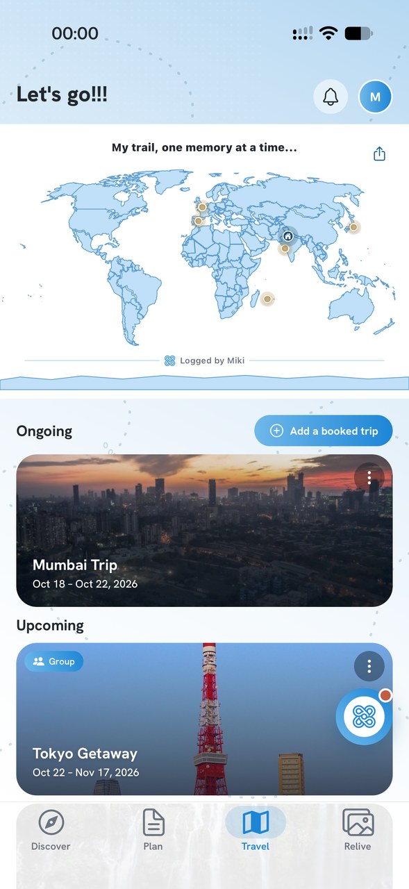 Miki's Travel screen with a world map of trips and upcoming trips